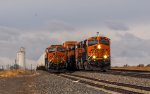 BNSF 7898 leads EB stacks passing a train led by BNSF 3739 